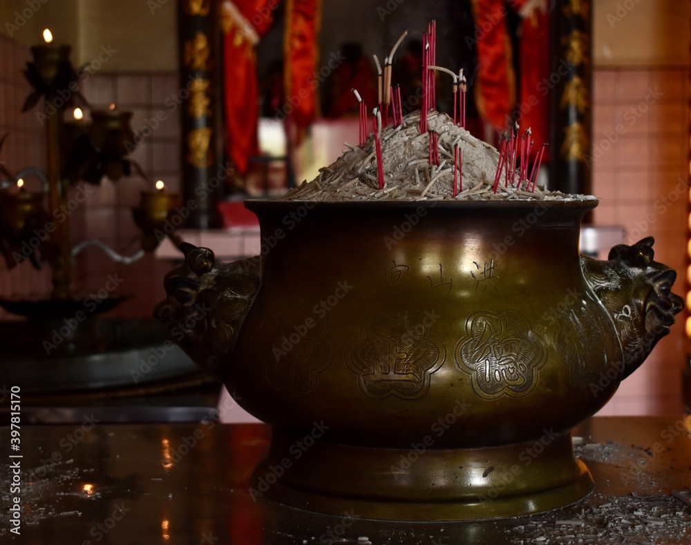 Sticker golden incense bowl on a shrine at a chinese temple with gong shan hong (temple, mountain, food) wri