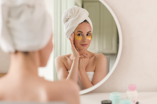 Beauty face woman natural healthy cosmetic skin pure suresh beautiful female happy smile portrait manicure hand. Beauty portrait of an attractive girl with a gold patch under the eyes.