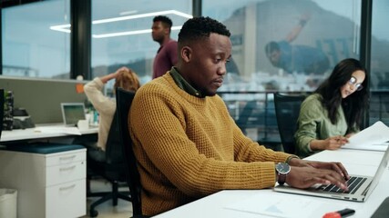African American male working on laptop typing fast emails working with colleagues in office  - Powered by Adobe