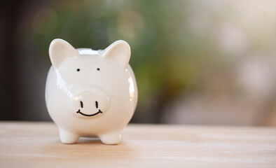 Piggy bank on old wood vintage style and copy space using as background concept to saving money, money for future with bokeh background.