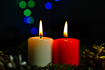 Obraz na płótnie Canvas christmas candles on a black background
