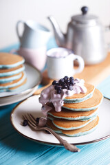 Stack pancakes with philadelphia cheese and blueberries