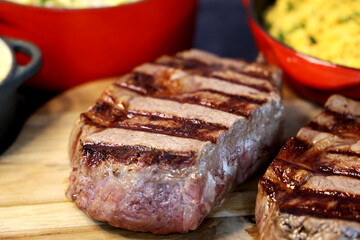 Rib Eye steak grilled in barbecue grill. With excellent accompaniment to meats.