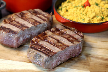 Rib Eye steak grilled in barbecue grill. With excellent accompaniment to meats.
