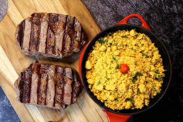 Rib Eye steak grilled in barbecue grill. With excellent accompaniment to meats.