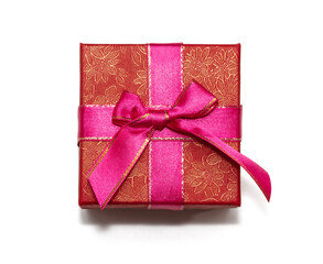 Red gift box with purple ribbon bow. Isolated on white background, top view. Christmas, New year's, St. Valentine's, birthday gift concept