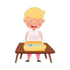 Little Boy Standing at Table and Splashing in Water Basin with Fish Vector Illustration