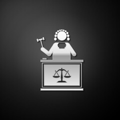 Silver Judge with gavel on table icon isolated on black background. Long shadow style. Vector.