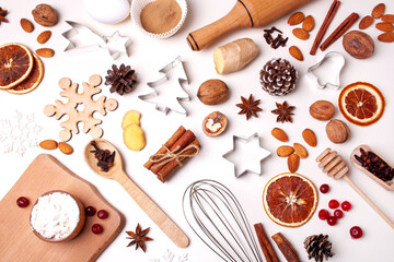Fototapeta na wymiar Ingredients for baking gingerbread cookies. Nuts, metal molds, spices and cinnamon. Flat lay style