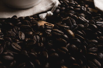 Coffee beans and coffee cup with coffee,old bag - obrazy, fototapety, plakaty