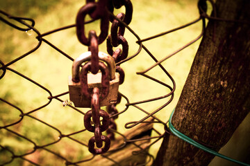 Fototapeta na wymiar abandoned zone with rusty chain and padlock