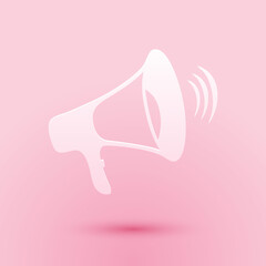 Paper cut Megaphone icon isolated on pink background. Paper art style. Vector.