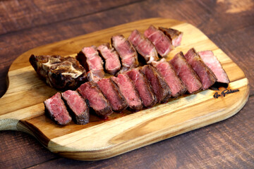 Short Rib. Delicious cut of meat located on the rib of the cow. In wooden background