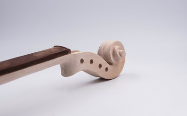 Raw Scroll of Violin put on white background,