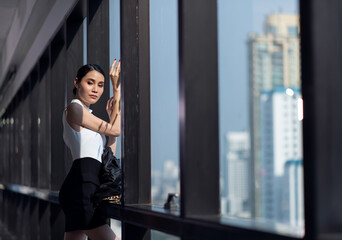 Fototapeta premium Businesswoman working in the office with looking out of the window