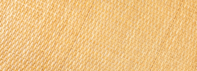 Yellow rattan texture. Copy space. Close up