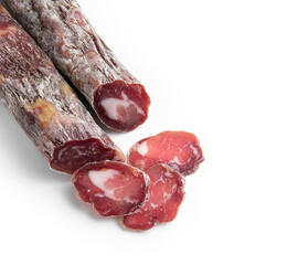 Dried sausage sliced into slices on a white plate. Elite meat product