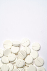 Heap of pills tablets over light grey background