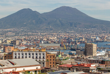 Naples, Italy - probably the most notable landmark in Napoli and potentially an active volcano, Mount Vesuvius stands out on the background of the city