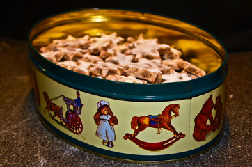 delicious cinnamon stars, cookies, in a tin with beautiful old fashioned motives