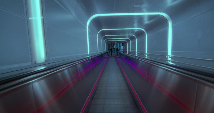 Empty view of futuristic clean modern walkway, travelator in space station or airport arrival departure hall. Spacey urban and minimalist pass way, passenger transport between terminals