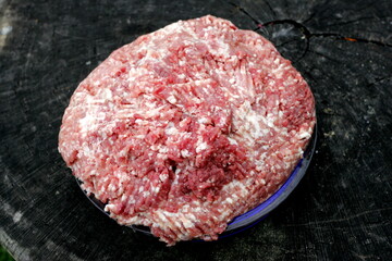 Fresh Raw mince, Minced beef. Close-up of minced meat in a glass bowl, Minced meat mix with fat for homemade sausage, Minced meat background