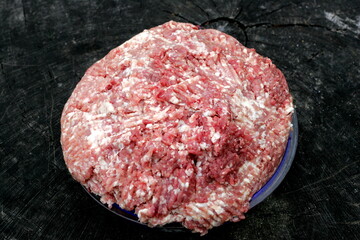 Fresh Raw mince, Minced beef. Close-up of minced meat in a glass bowl, Minced meat mix with fat for...