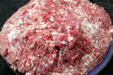 Fresh Raw mince, Minced beef. Close-up of minced meat in a glass bowl, Minced meat mix with fat for homemade sausage, Minced meat background