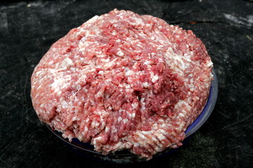 Fresh Raw mince, Minced beef. Close-up of minced meat in a glass bowl, Minced meat mix with fat for homemade sausage, Minced meat background