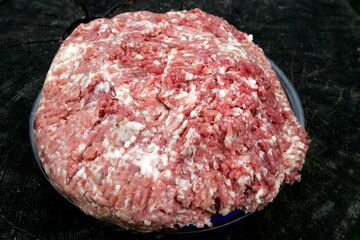 Fresh Raw mince, Minced beef. Close-up of minced meat in a glass bowl, Minced meat mix with fat for homemade sausage, Minced meat background