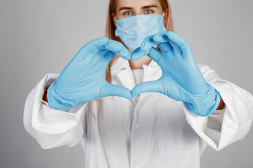 Fototapeta premium Doctor in a medical mask. Coronavirus theme. Isolated over white background