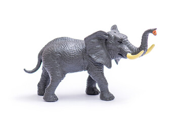Plastic model of elephant. Elephant toy isolated on white.