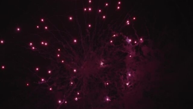 Glowing Pink Fireworks Isolated On Black Background. - Low Angle Shot, Slow Motion