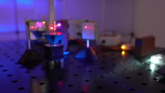  laser in a quantum optics lab. Semiconductor laser on optical table in a quantum physics optics lab.