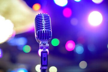 Retro microphone on christmas multicolored background