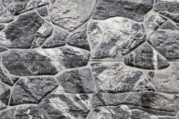 Artificial stone backdrop is similar to natural.