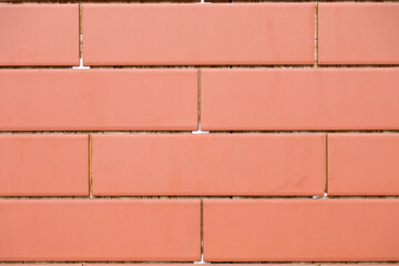 Exhibit of a brick wall made of ceramic tiles.