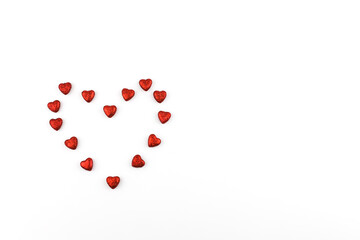 Small red hearts are symbol of Valentine's Day