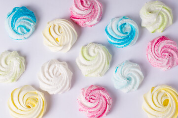 Homemade sweet colored meringue on white background.  .Dessert.