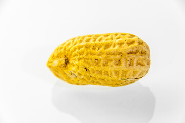 London, United Kingdom, December 05, 2020: Peanuts aka groundnuts on board in shells
