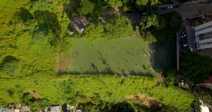 Aerial view of a soccer game and field during a golden hour, in Caracas, Venezuela