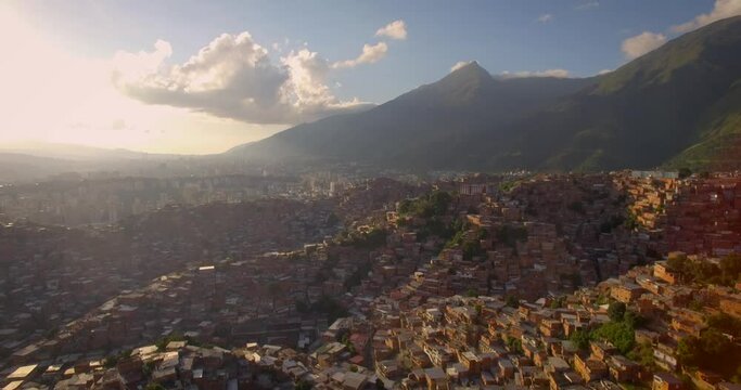 From the top view of Petare slum, in Caracas, Venezuela, during a sunset