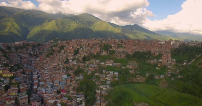 Drone aerial view of Petare slum, in Caracas, Venezuela, during a sunset