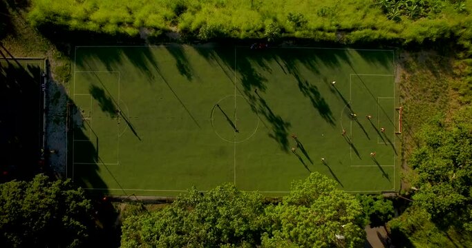 Aerial view of a soccer game and field during a golden hour, in Caracas, Venezuela