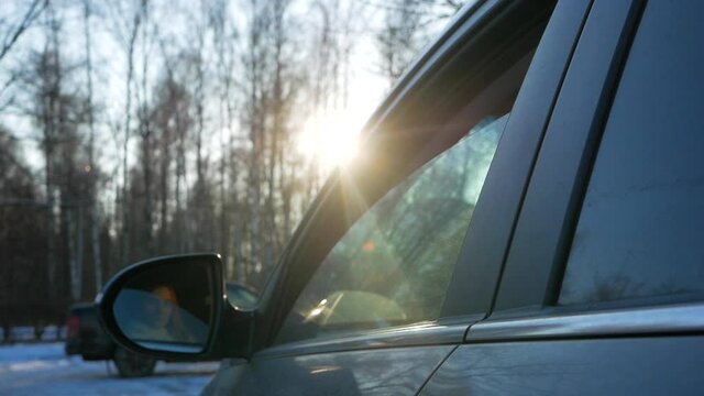 girl throws trash out of the car window. Environmental pollution by drivers. Prolongation of environmental pollution