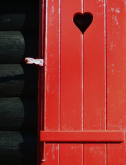 red heart on a wooden window