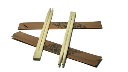 Two couples sushi chopsticks on white background. Copy space