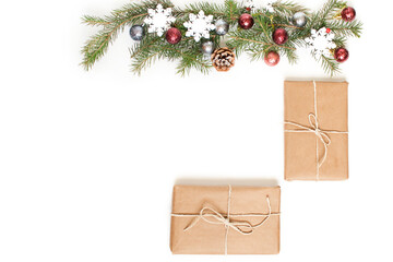 Christmas decorations with spruce branches and gift boxes on a white background.