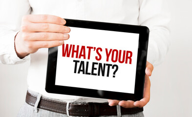 Text Whats Your Talent on tablet display in businessman hands on the white bakcground. Business concept