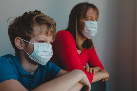 Mother And Son With Masks Stay Home